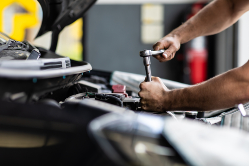 mechanic working on car