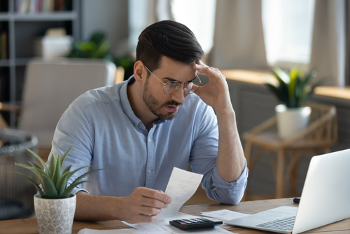person stressed over bills